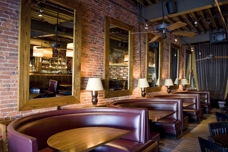 Classy Restaurant Bar with Booths, Mirrors and Red Brick Walls